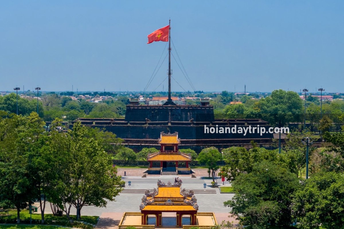 Hue Imperial Citadel gate illuminated at sunset with symmetrical golden hour composition