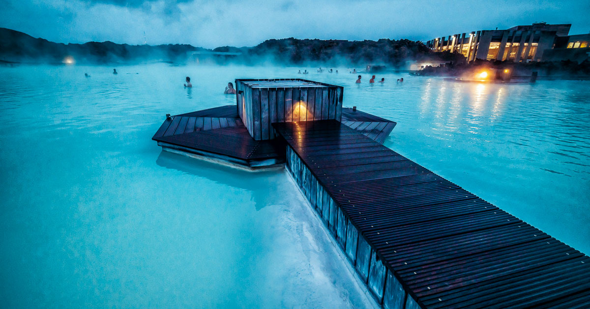Blue Lagoon geothermal spa at twilight with glowing turquoise water and steam, Iceland