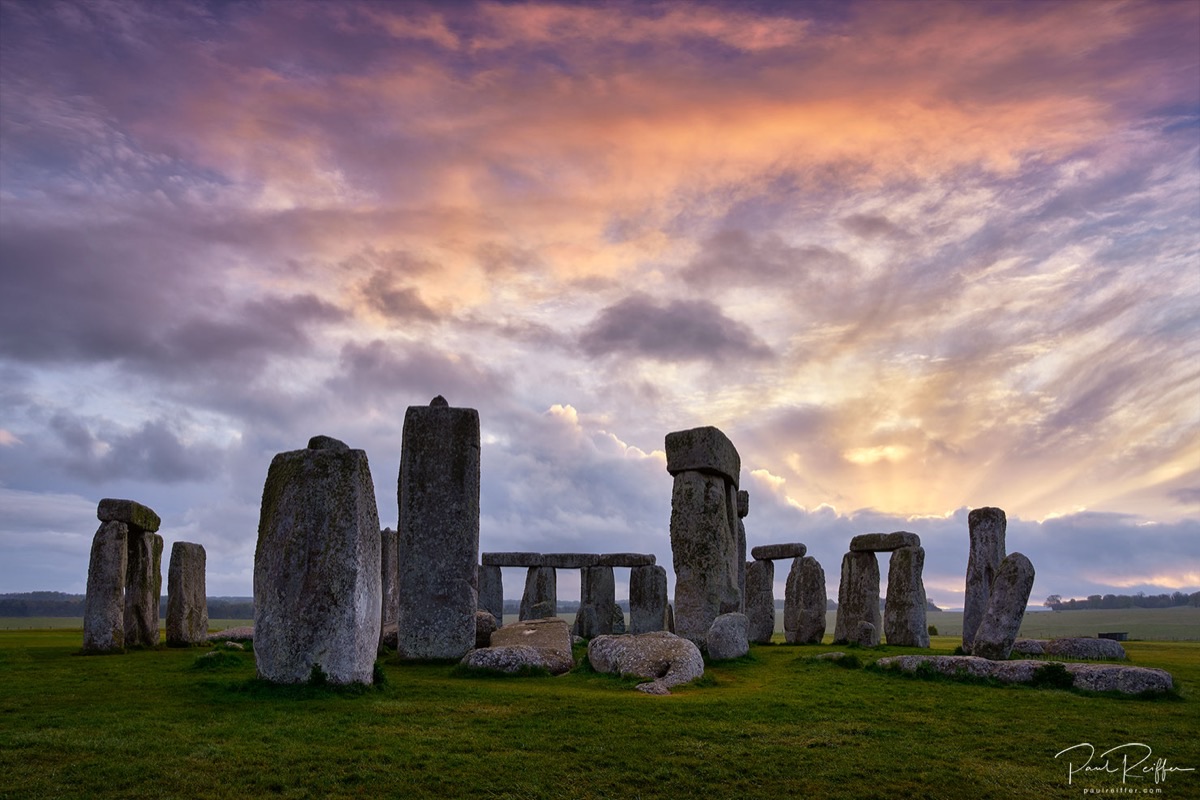 Stonehenge ancient stones against a dramatic sky at sunrise, Wiltshire England