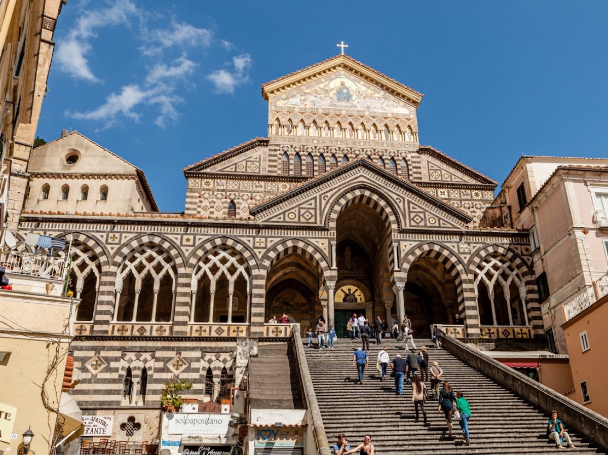 Amalfi Cathedral Duomo facade with golden mosaic and iconic staircase, Italy