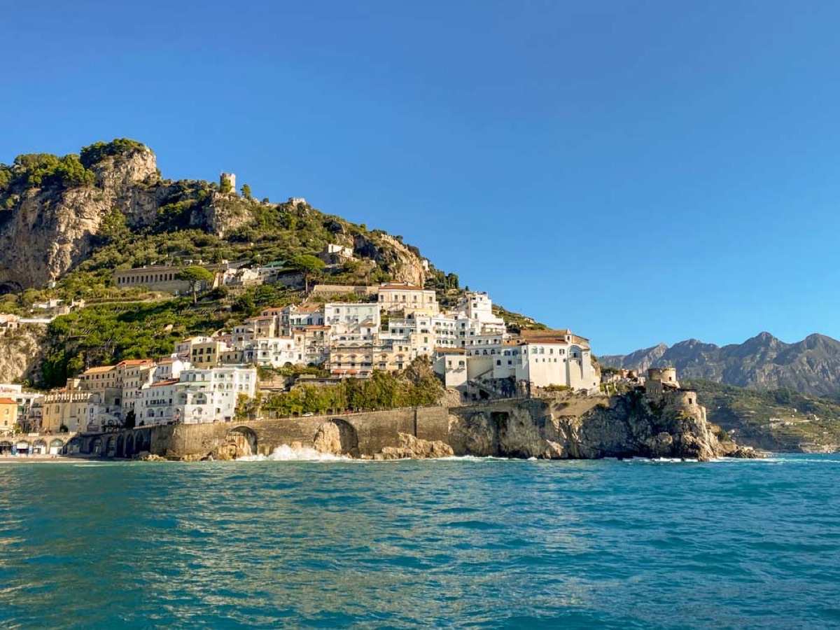 Amalfi Coast cliffside buildings viewed from the water on a boat tour