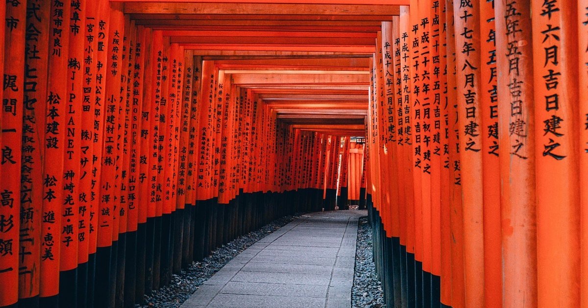 Endless tunnel of vermillion torii gates at Fushimi Inari Taisha shrine in Kyoto