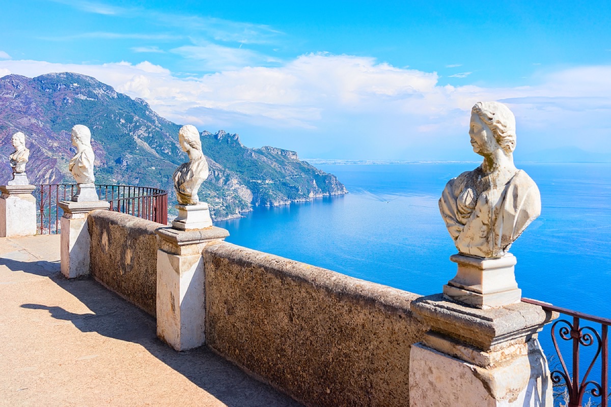 Marble busts and stone balustrade of Villa Cimbrone's Terrace of Infinity overlooking the Amalfi Coast