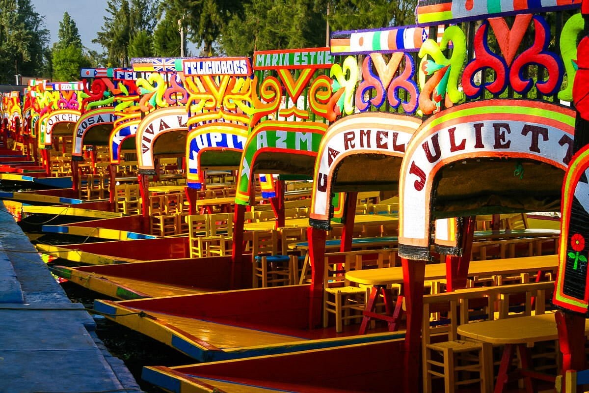Colorful trajinera boats lined up at Xochimilco floating gardens, Mexico City