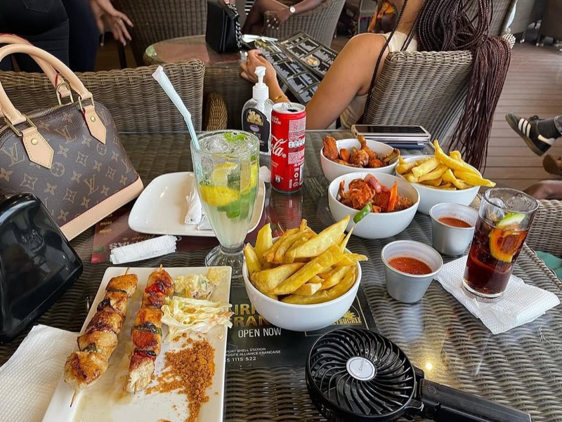 Honey Suckle Pub & Restaurant casual pub fare spread in Labone, Accra