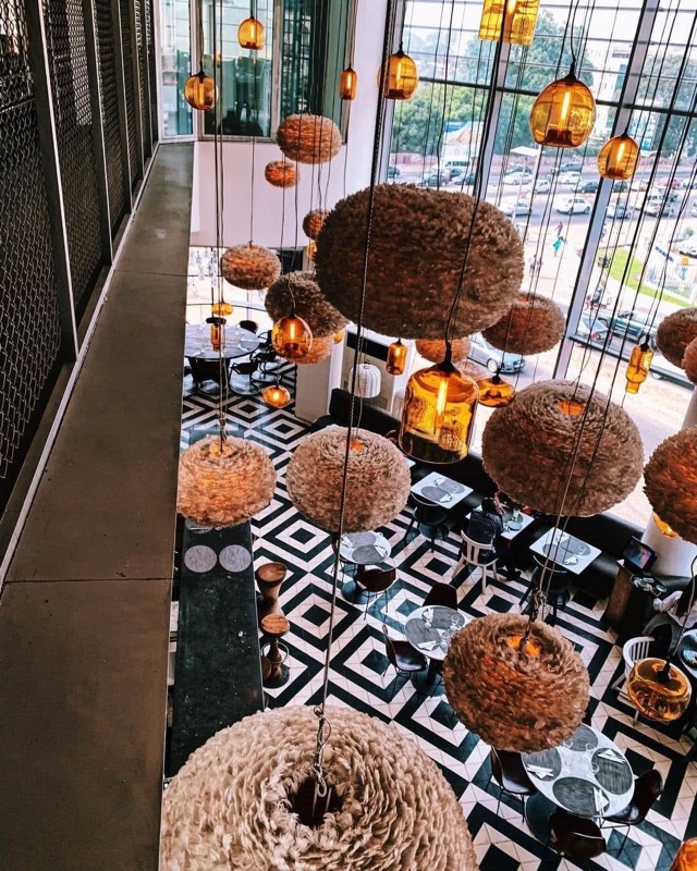 Urban Grill interior with dramatic lighting in Airport City, Accra