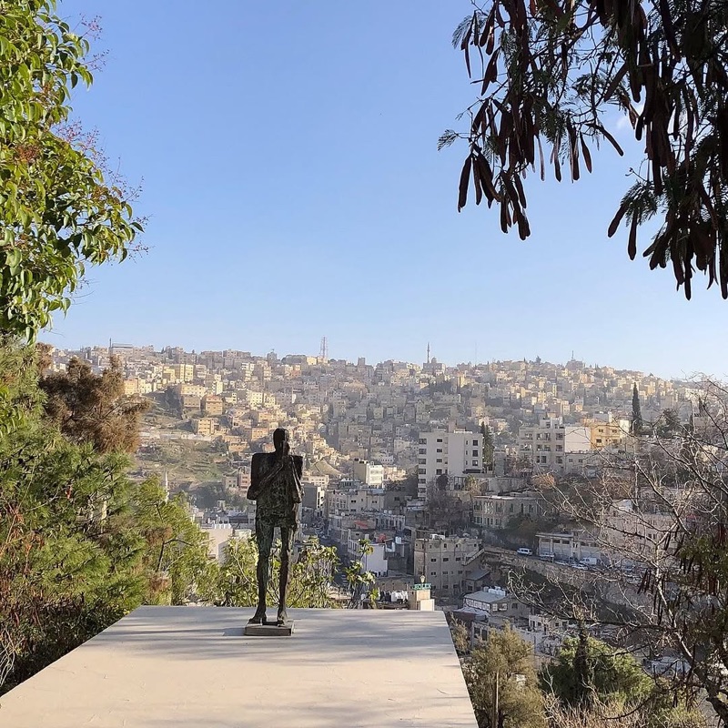 Bronze sculpture in the gardens of Darat al Funun with Amman city views in Jabal Lweibdeh