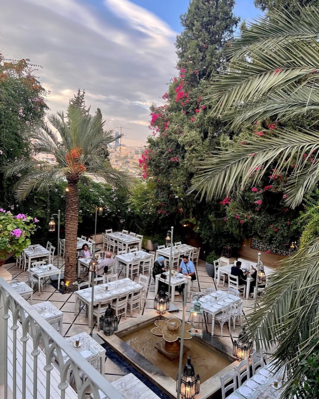 Sufra Restaurant garden terrace at golden hour on Rainbow Street, Amman