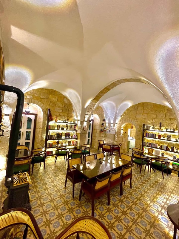 Blue Fig cafe interior with vaulted stone arches and warm ambiance in Abdoun, Amman