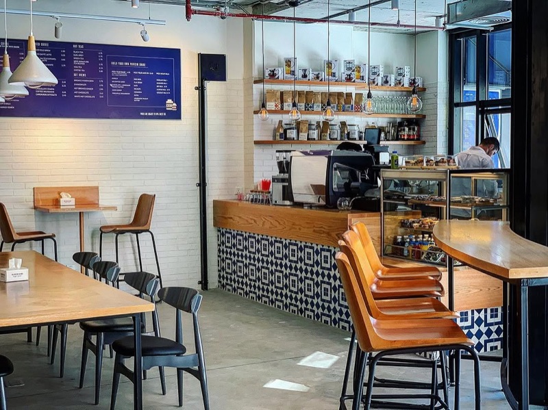 Caffeine Lab specialty coffee shop interior with blue tile design in Sweifieh, Amman