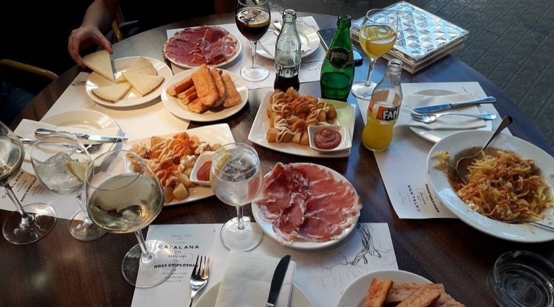 Cervecería Catalana tapas spread on bar counter
