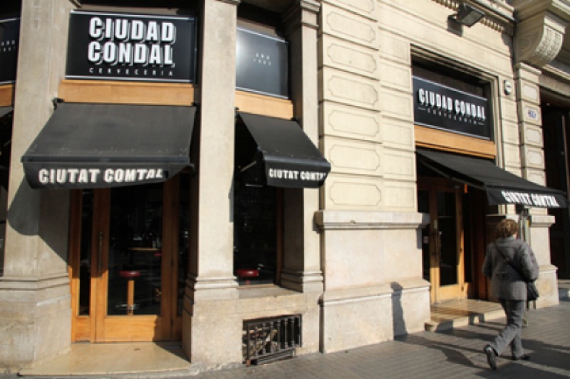 Ciudad Condal tapas bar counter with spread of dishes