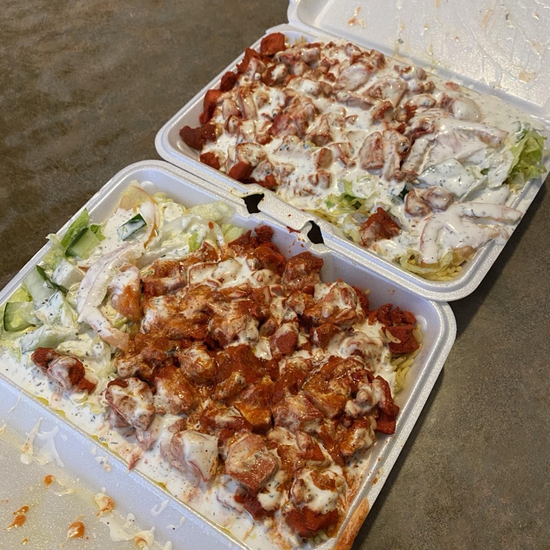 The Halal Guys chicken over rice platter in Midtown NYC