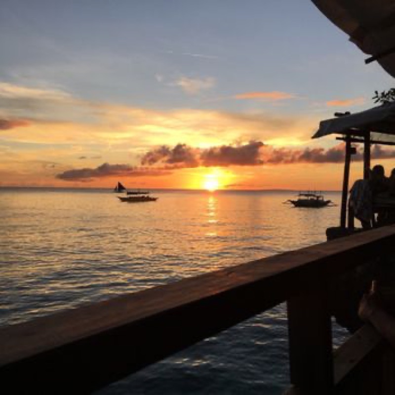 Spider House Resort cliffside bar overlooking the ocean at sunset in Boracay