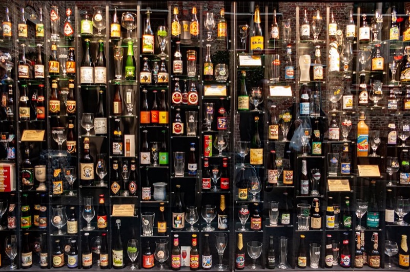 The iconic 2be beer wall with hundreds of Belgian beer bottles in Bruges, Belgium