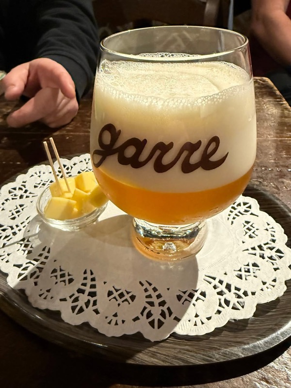 De Garre beer bar interior with cozy brick walls and warm lighting in Bruges, Belgium