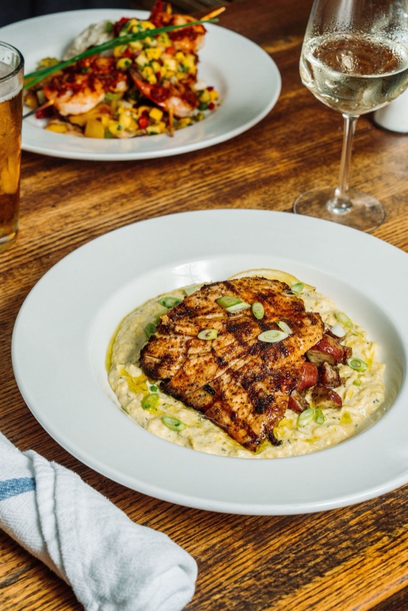 Coast Bar and Grill in Historic District — Tucked away off King Street, Coast offers a vibrant, open-air setting perfect fo