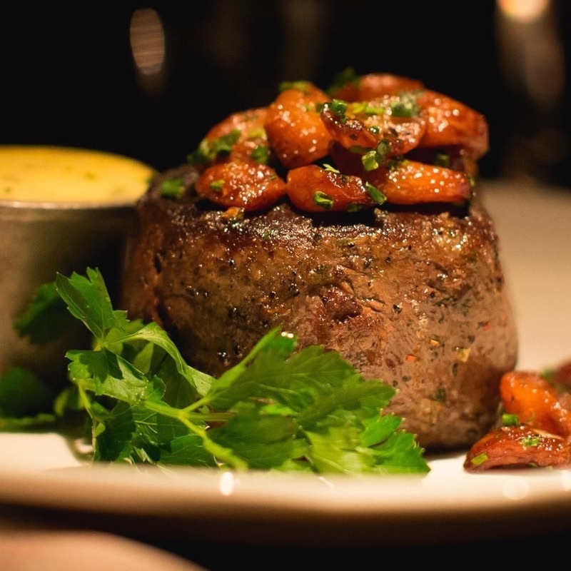 Bavette's Bar & Boeuf in River North — Bavette's offers a unique, dimly lit speakeasy ambiance with a distinct French i