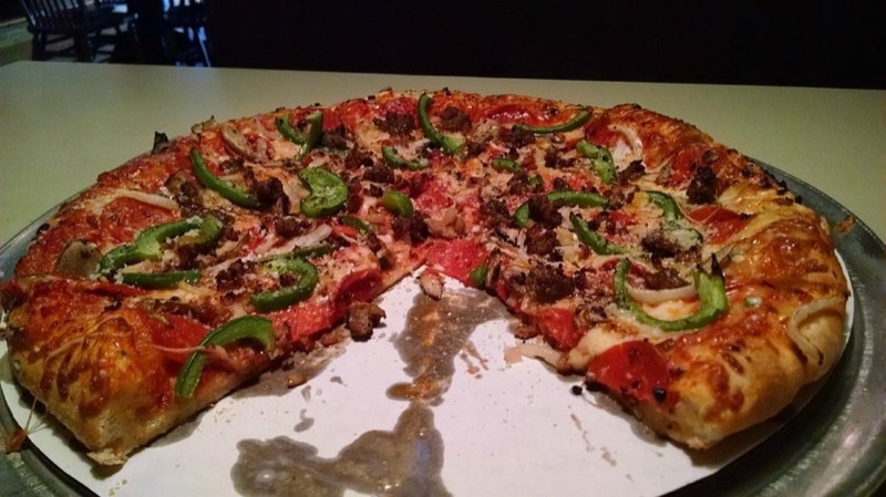 Hounddog's Three-Thirds Pizza & Pub in OSU Campus — Hounddog's offers a unique 'three-thirds' deep-dish pizza, known for its thick, 