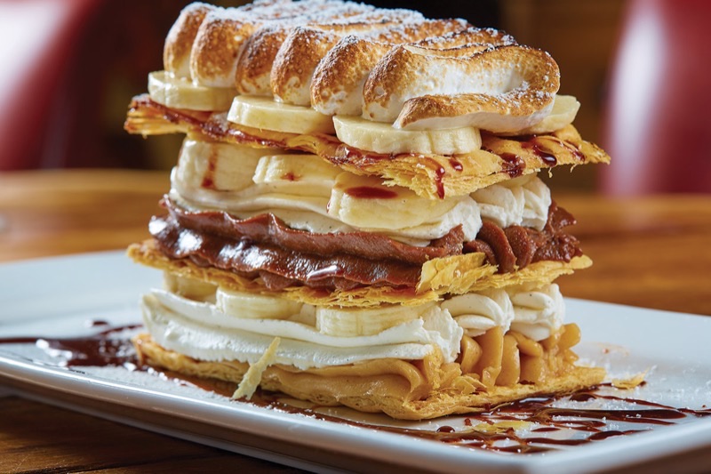 Town Hearth in Design District — Step into a whimsical world at Town Hearth, where vintage cars, a grand piano, a