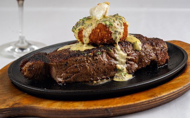 Perry's Steakhouse & Grille in Uptown — Perry's is famous for its award-winning, seven-finger-high pork chop, but it's a