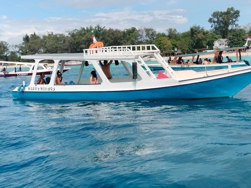 Glass bottom boat for snorkeling tour around the Gili Islands