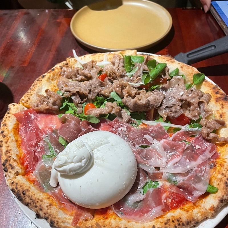 Pizza 4P's in District 1 (Multiple locations, e.g., Le Thanh Ton) — Pizza 4P's has revolutionized the pizza scene in Vietnam with its unique Japanes