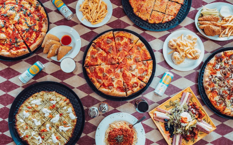 Pizza Meter in Mamilla — Pizza Meter offers a unique 'pizza by the meter' concept, allowing diners to cho