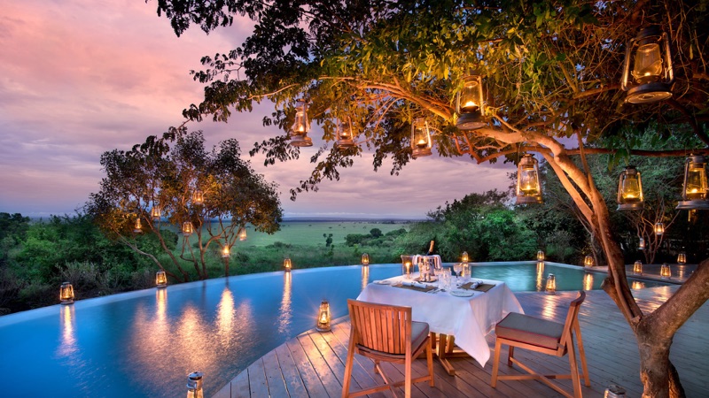 andBeyond Bateleur Camp romantic dinner on the deck overlooking the Mara