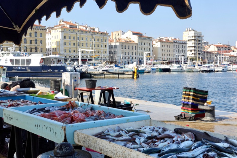 Fishermen selling fresh catch at the Vieux-Port fish market in Marseille