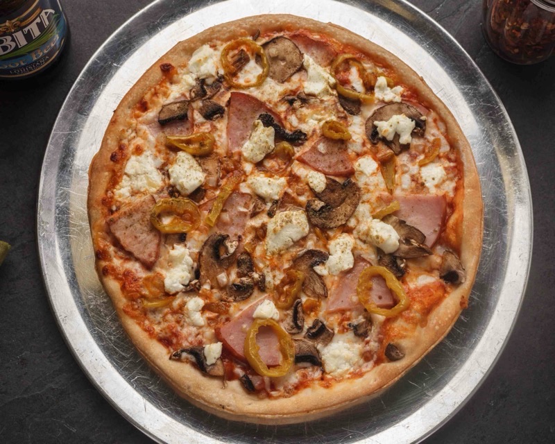 Theo's Neighborhood Pizza in Multiple (Uptown, Mid-City, etc.) — Theo's Neighborhood Pizza is a popular local chain known for its diverse menu, c