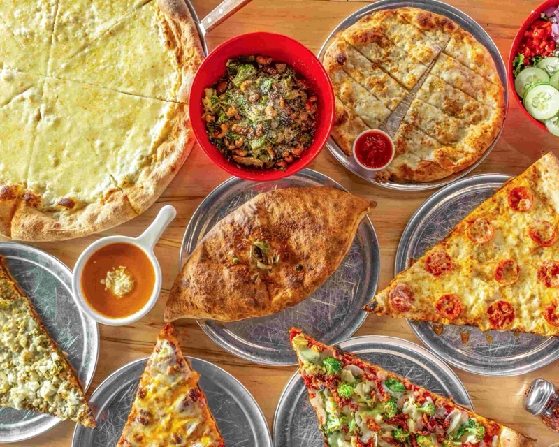 Lazy Moon Pizza in Mills 50 — A true Orlando institution, Lazy Moon is famous for its massive, foldable New Yo