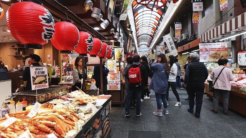 Kuromon Ichiba Market seafood stalls in Osaka