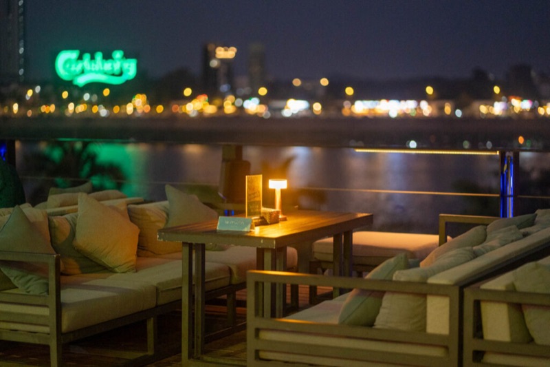 Le Moon Rooftop bar with romantic riverfront views at night in Phnom Penh