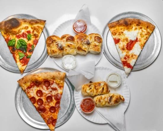 Badamo's Pizza in North Side — Badamo's serves up authentic New York-style pizza with a perfectly chewy crust a