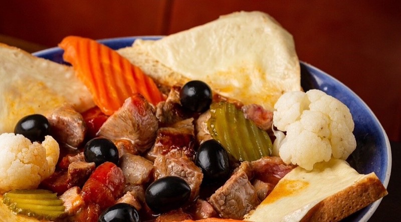 Taxca in Ribeira — Taxca is a quintessential tasca experience in Porto, offering a vibrant, no-fril