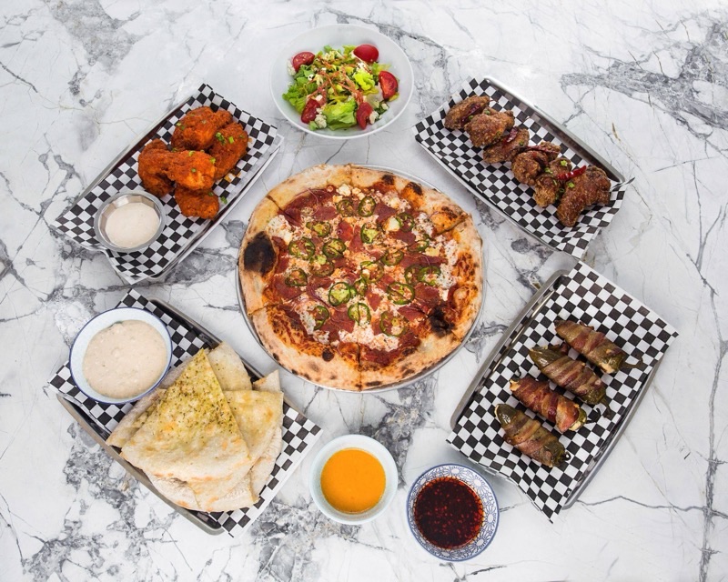 Playland Pizza in Downtown — Playland Pizza offers a fresh, modern take on New York-style pizza in a lively d