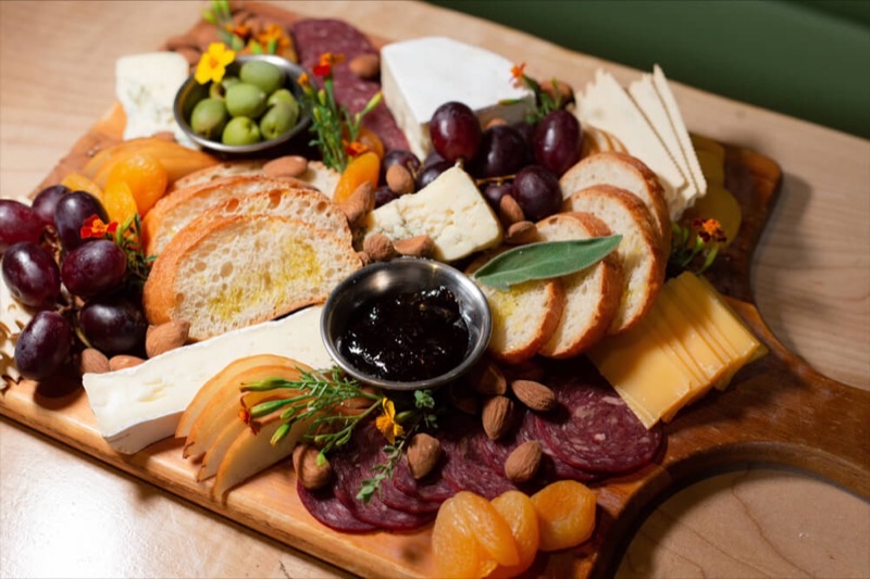 Vin de Syrah in Gaslamp Quarter — A whimsical wine parlor hidden behind an ivy-covered wall and secret door, Vin d