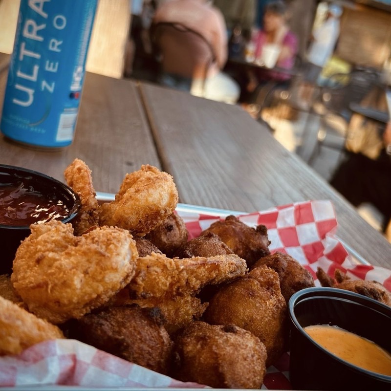 The Wyld Dock Bar in Moon River District — Perched on the marsh, The Wyld Dock Bar offers stunning waterfront views and a r