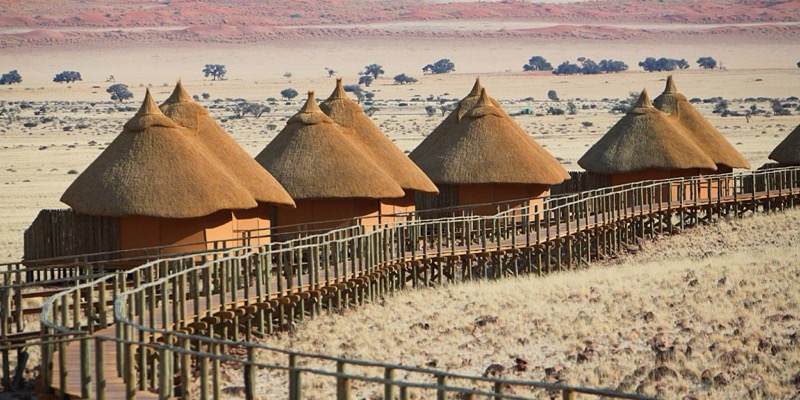 Sossus Dune Lodge wooden chalets inside the park gates at Sesriem