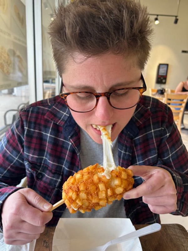 Korean corn dog coated in crispy batter with cheese stretching