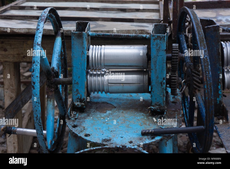 Fresh sugarcane juice being pressed at a cart in Stone Town Zanzibar