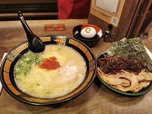 Ichiran Ramen in Shibuya — Ichiran is renowned for its immersive 'flavor concentration booths,' offering a 