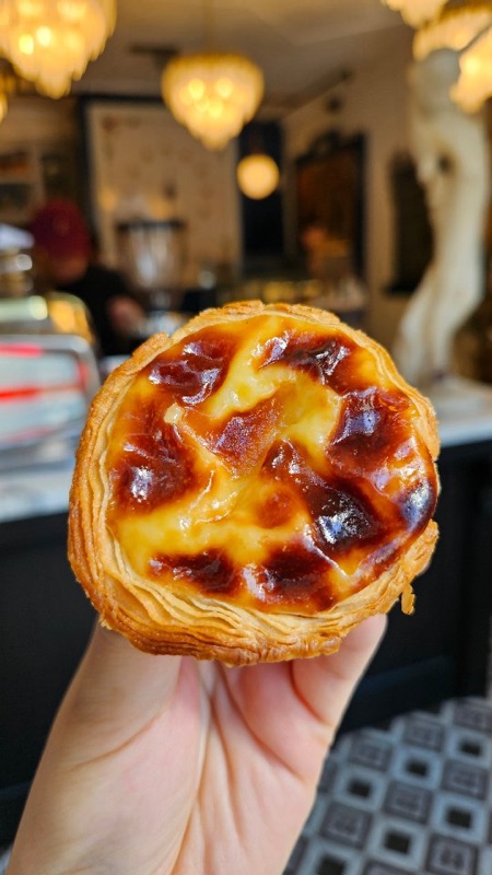 Hand-held pastel de nata at Café Belem, Toronto