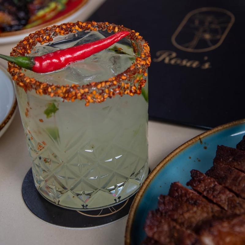 Table spread with Latin-inspired dishes at Rosa's in the Junction, Toronto