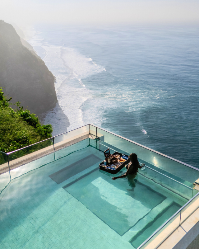 Oneeighty day club glass-bottom infinity pool extending over cliff