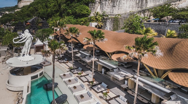 Tropical Temptation Beach Club glass-bottom pool and boho decor