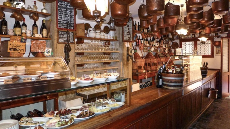 Cantina Do Mori interior with copper pots and historic bar counter in Venice